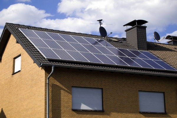 Solar Panel Cleaning: 7 Reasons Why You Should Consider It 2 Clean solar panels on a roof