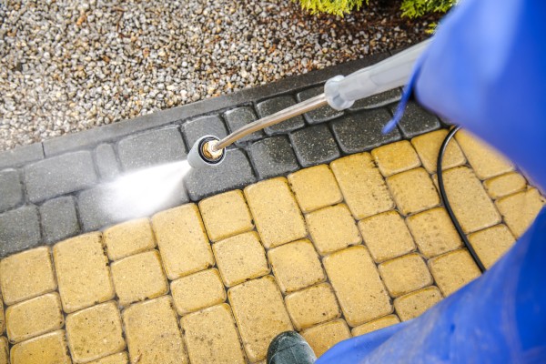 4 Types of Driveways and How to Clean Them 2 cleaning one of the types of driveways which is brick driveway